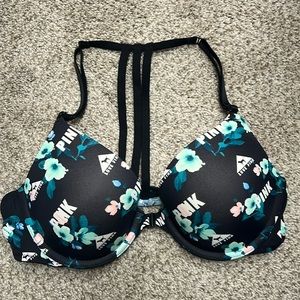 PINK black and green 36B bra. Unclips in front and has adjustable straps.